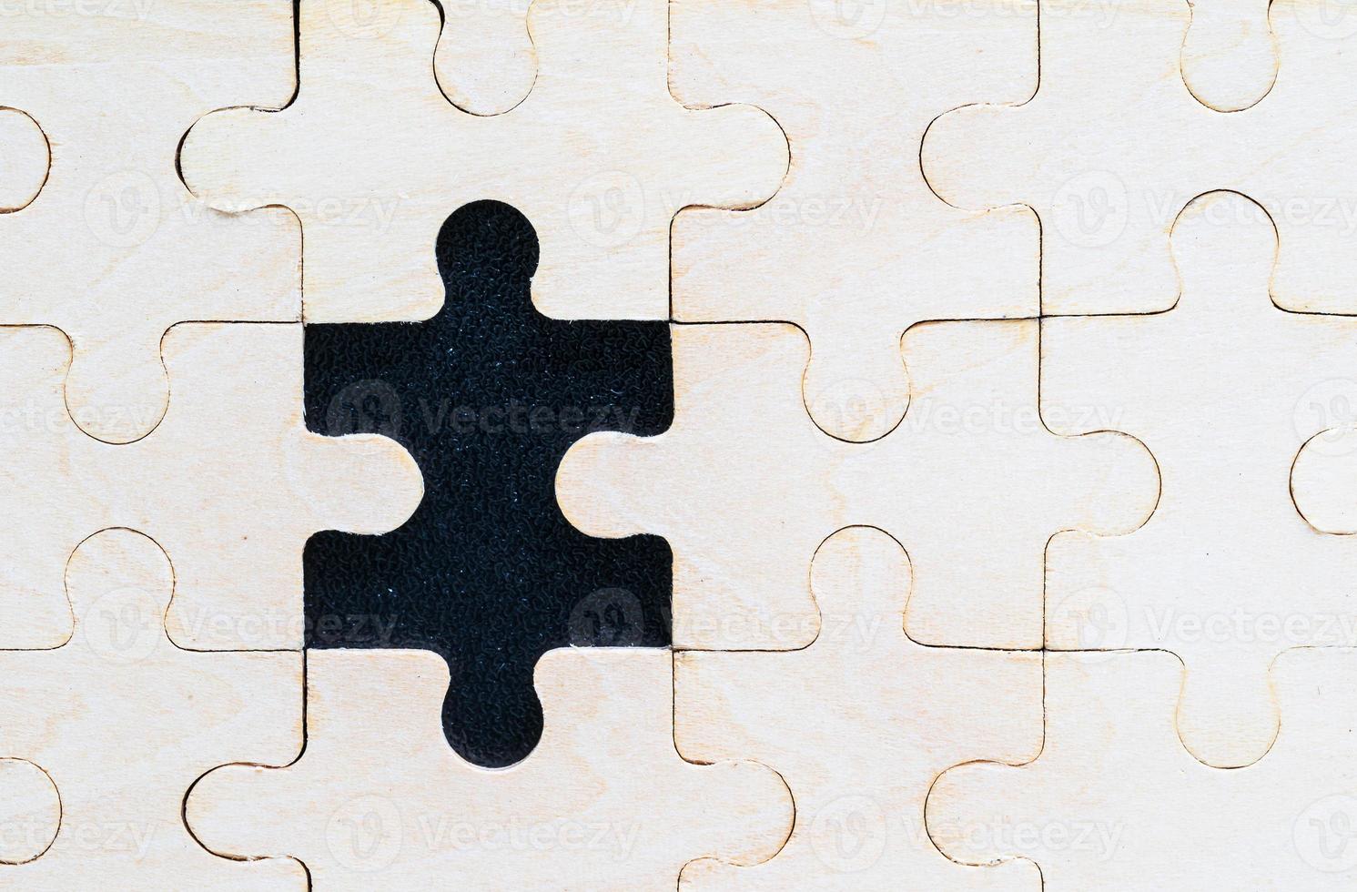 Close up wooden jigsaw puzzle pieces on black background 9324938 Stock