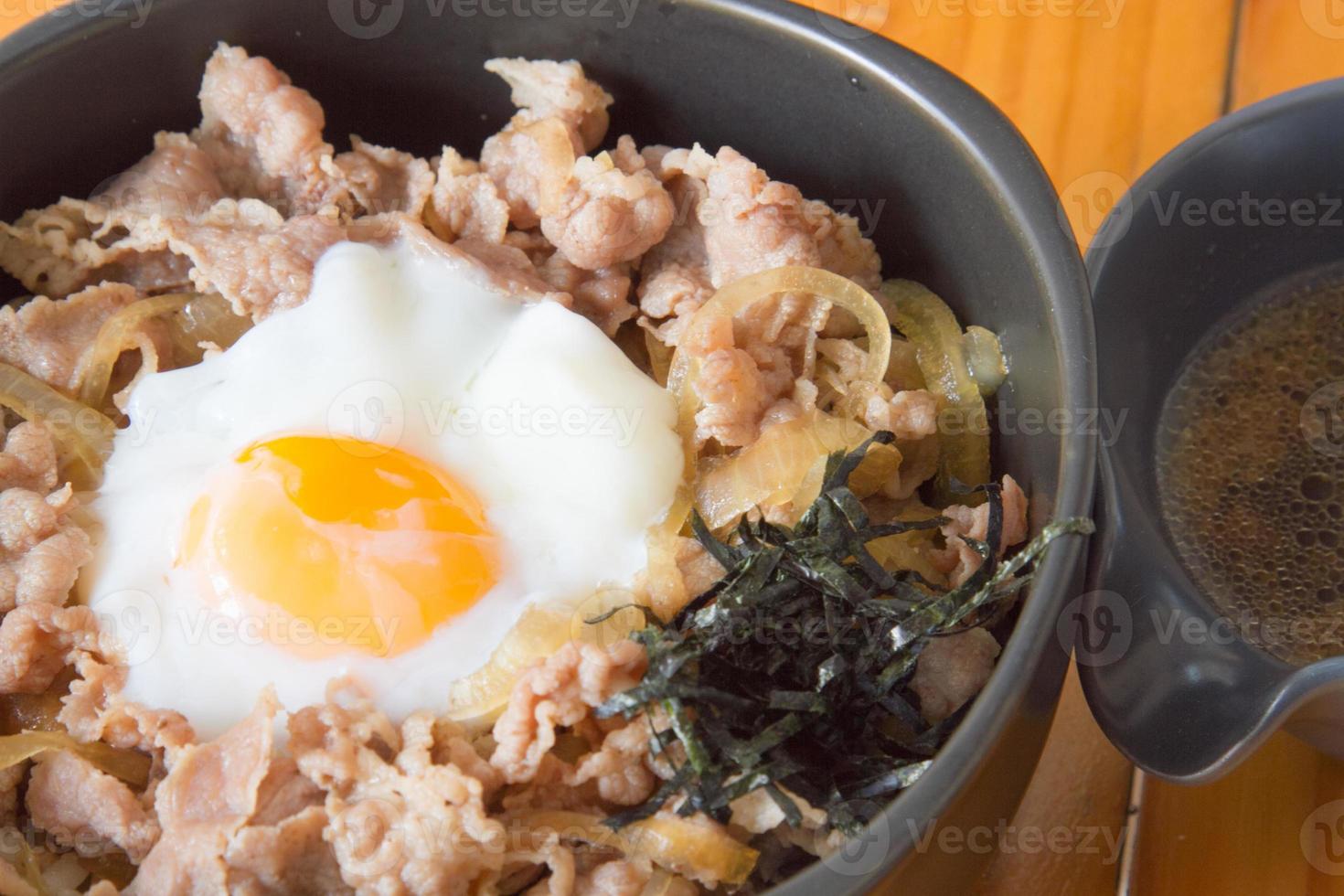 Fried Pork with Rice with Soy Sauce and Poached Egg photo