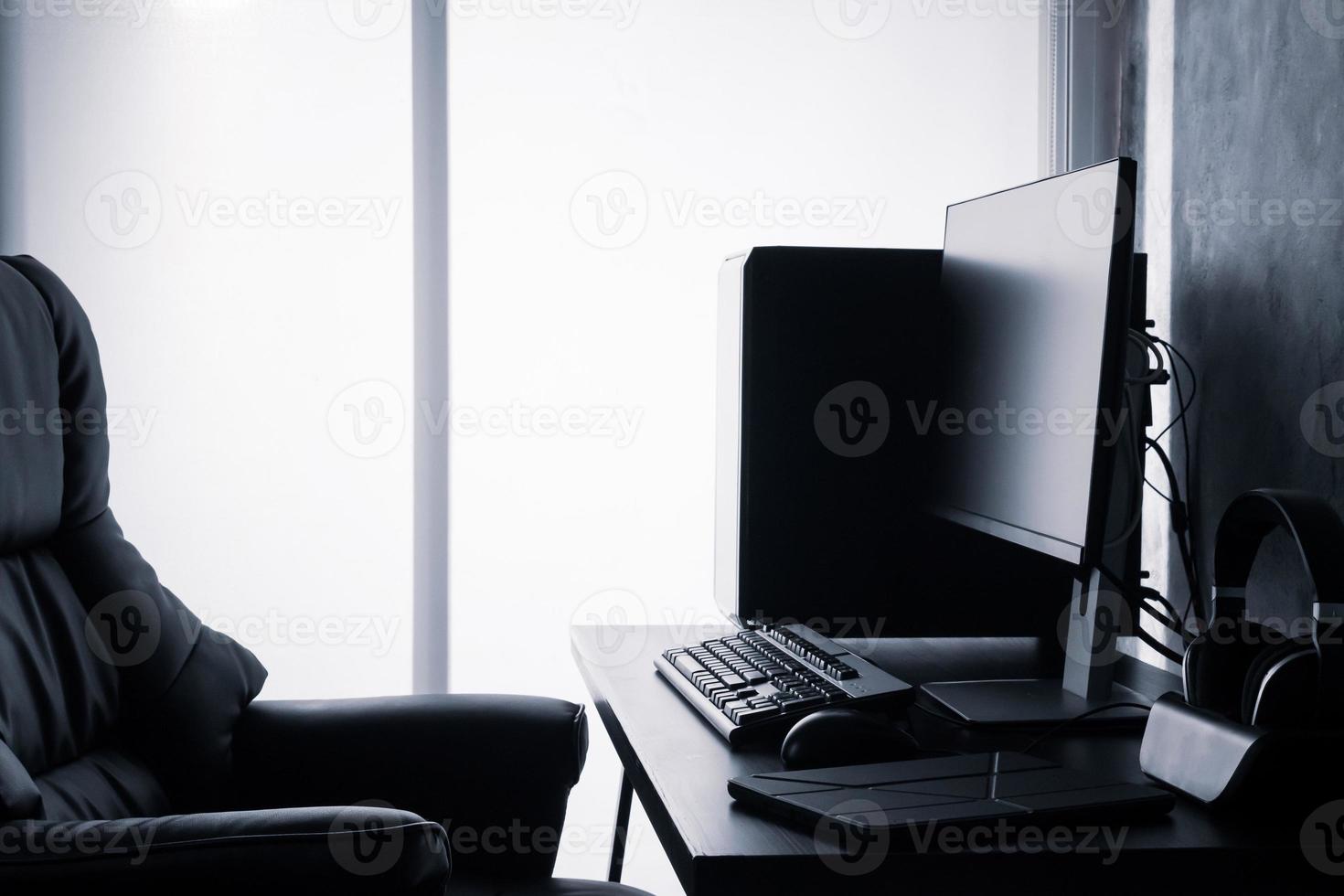 Black computer on the desk. photo