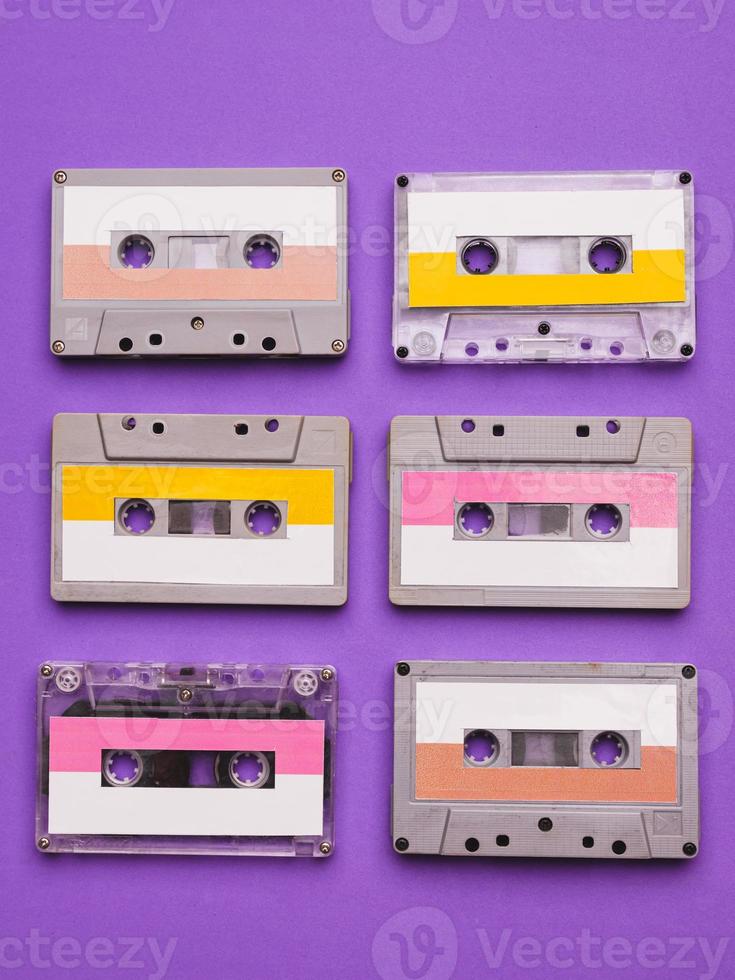 Collection of cassette tapes on purple background. photo