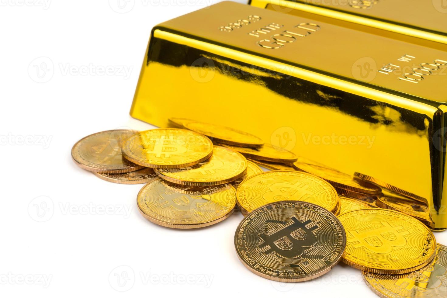 Bitcoins of new digital money and gold bars on white background photo