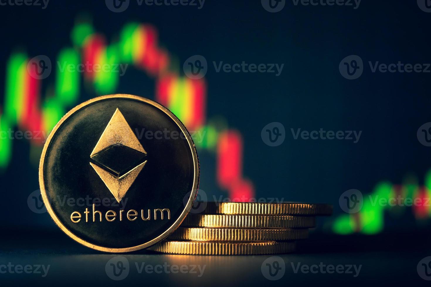 Stack of golden coins with ethereum symbol with stock graph background. photo
