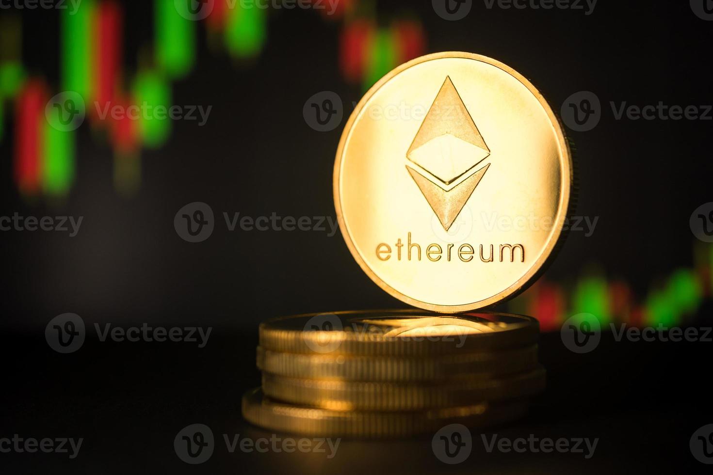 Stack of golden coins with ethereum symbol with stock graph background. photo