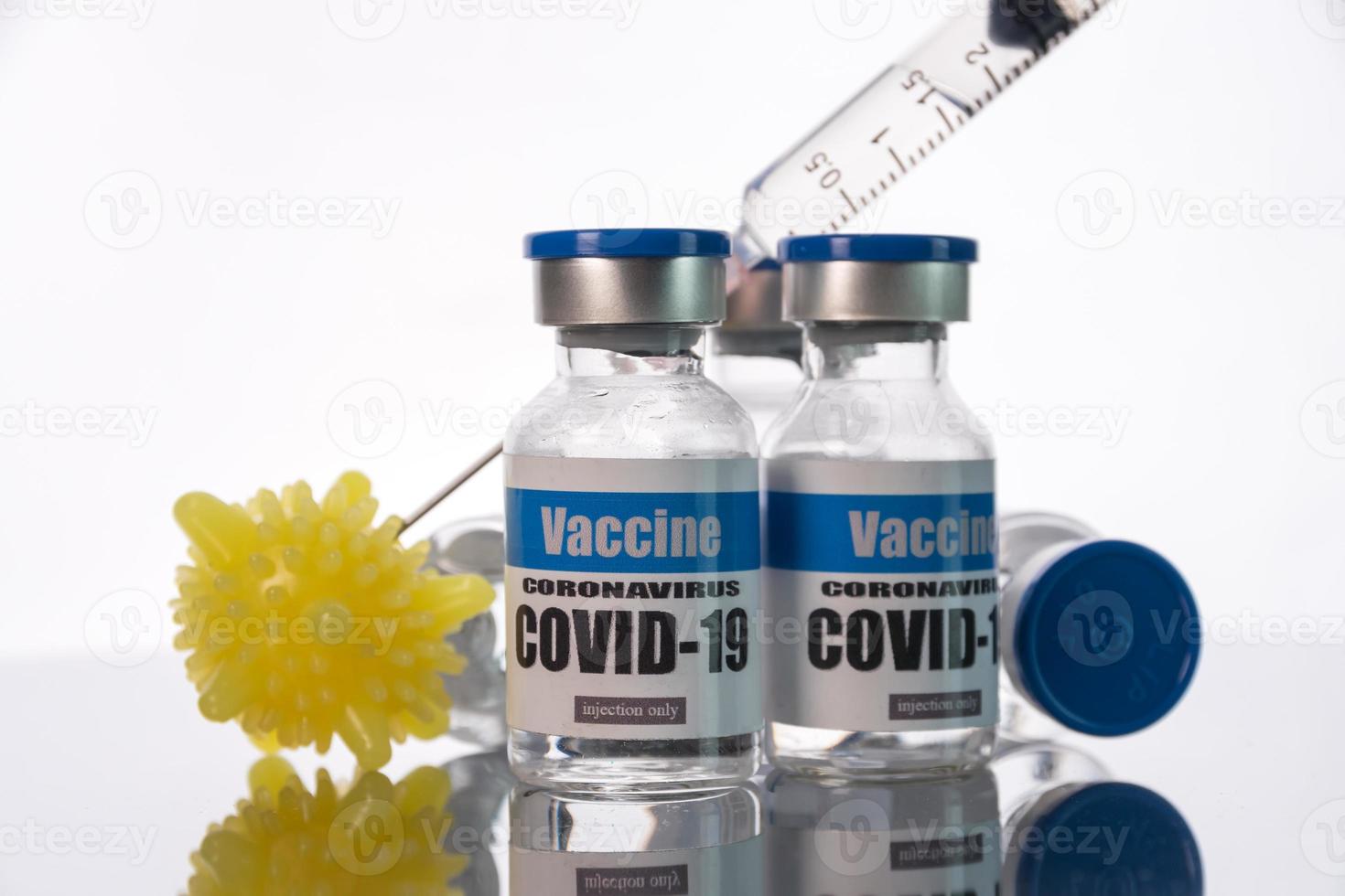 Glass vials for Covid-19 vaccine on white background. Group of Coronavirus vaccine bottles. photo