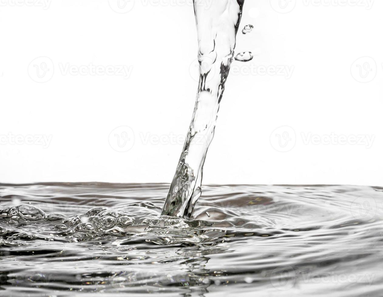 Close up of Pouring water on water surface background. photo