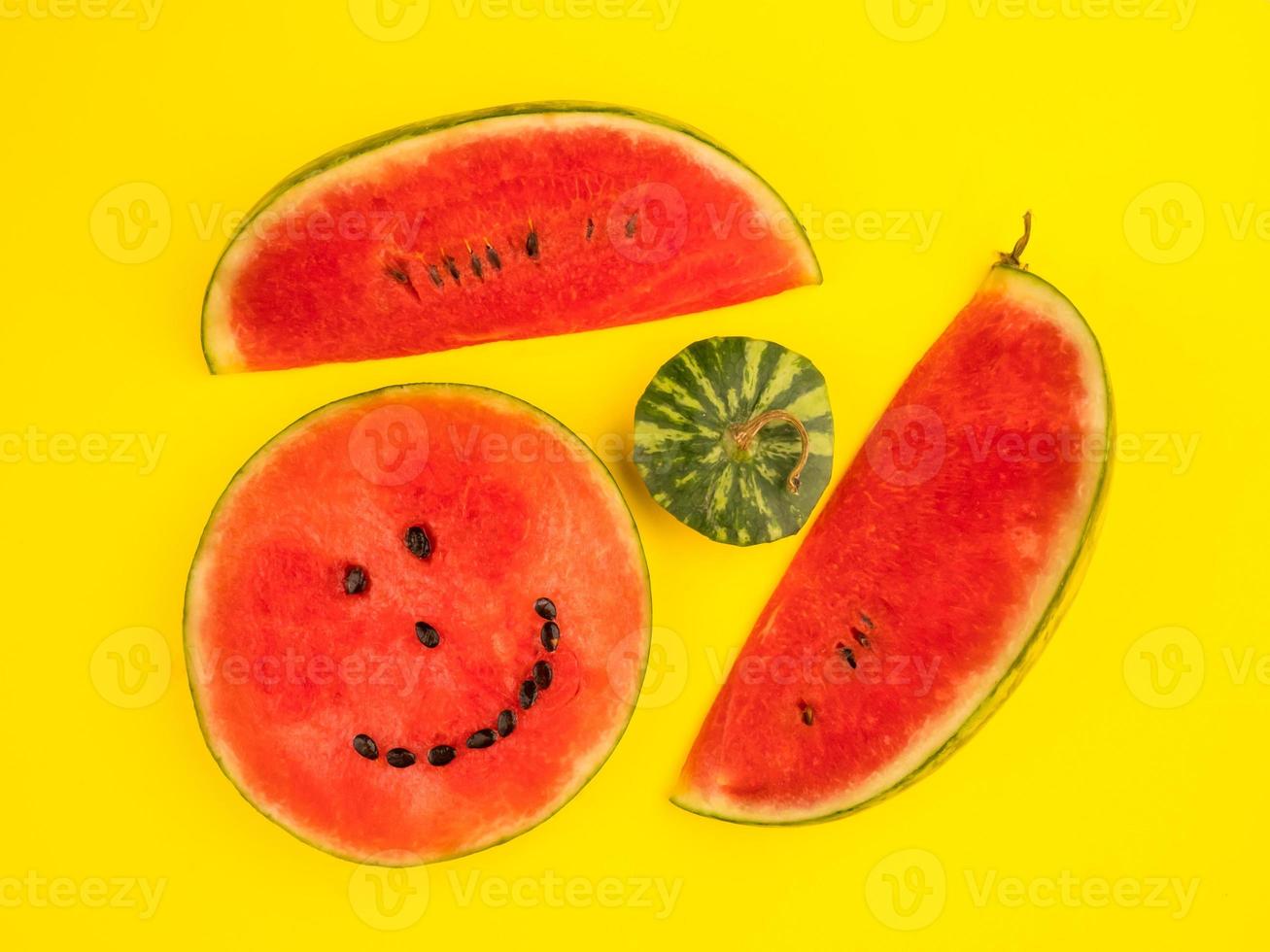 Fresh ripe watermelon slices on yellow background. photo