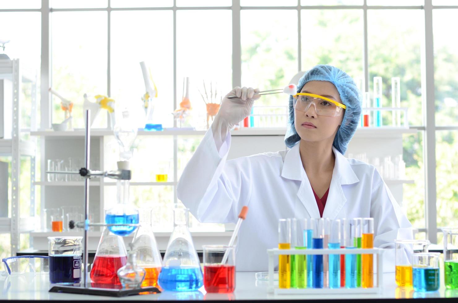 Woman scientist doing experiment. photo