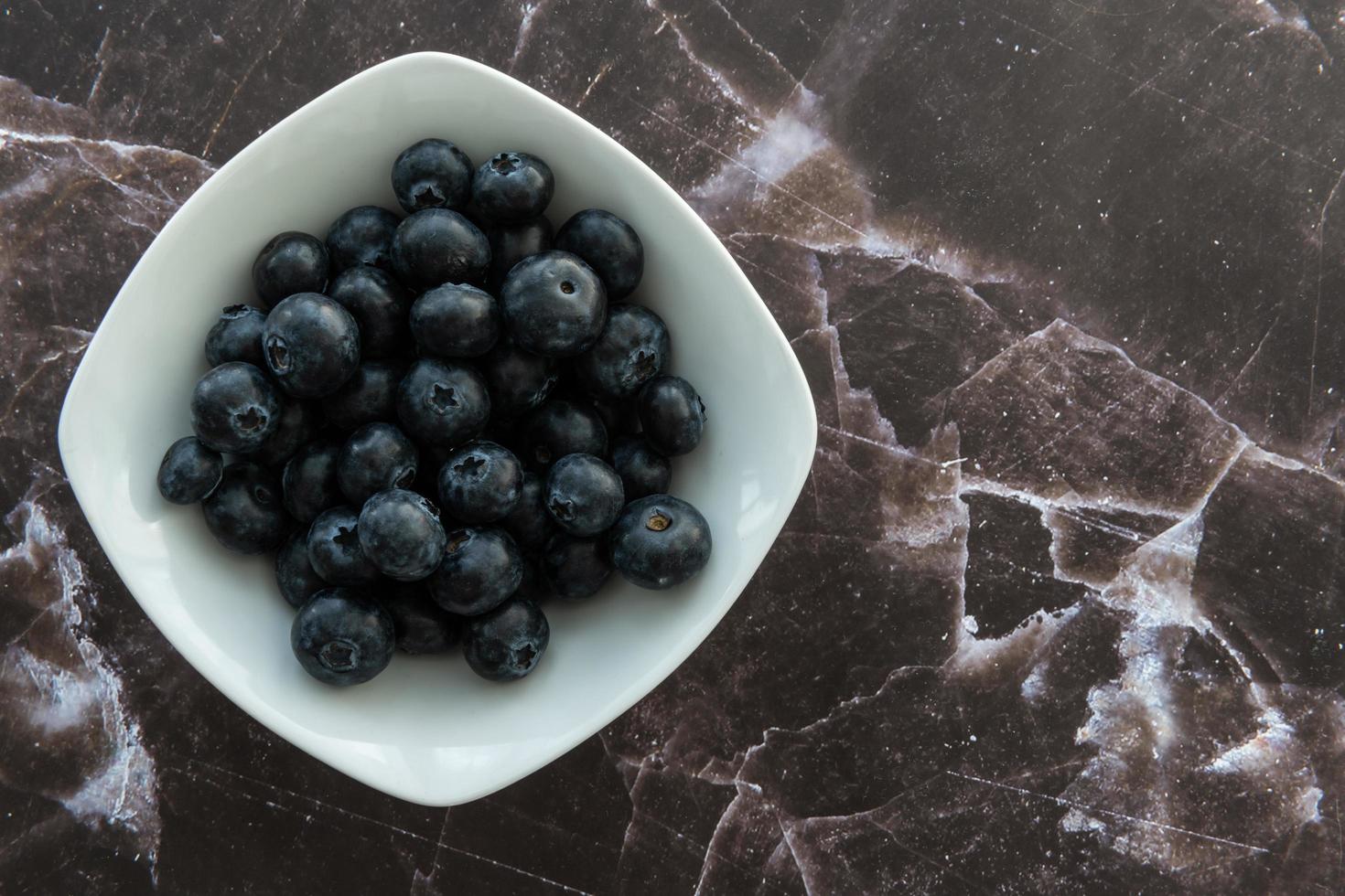 Delicious blueberries on a rustic background photo