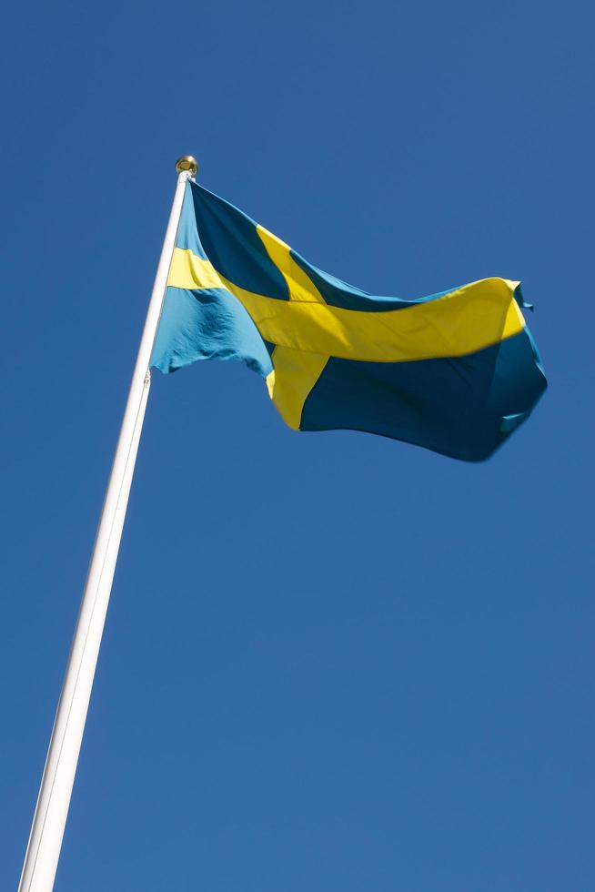 Swedish flag blowing in the wind photo