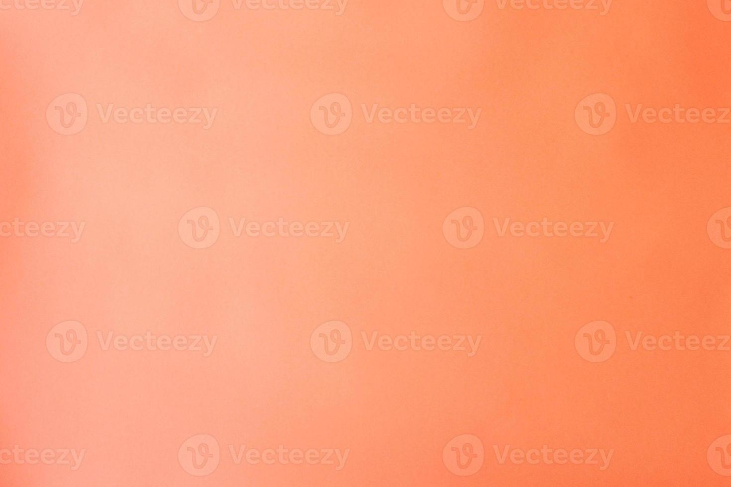 Peach pink paper background, blank color backdrop photo