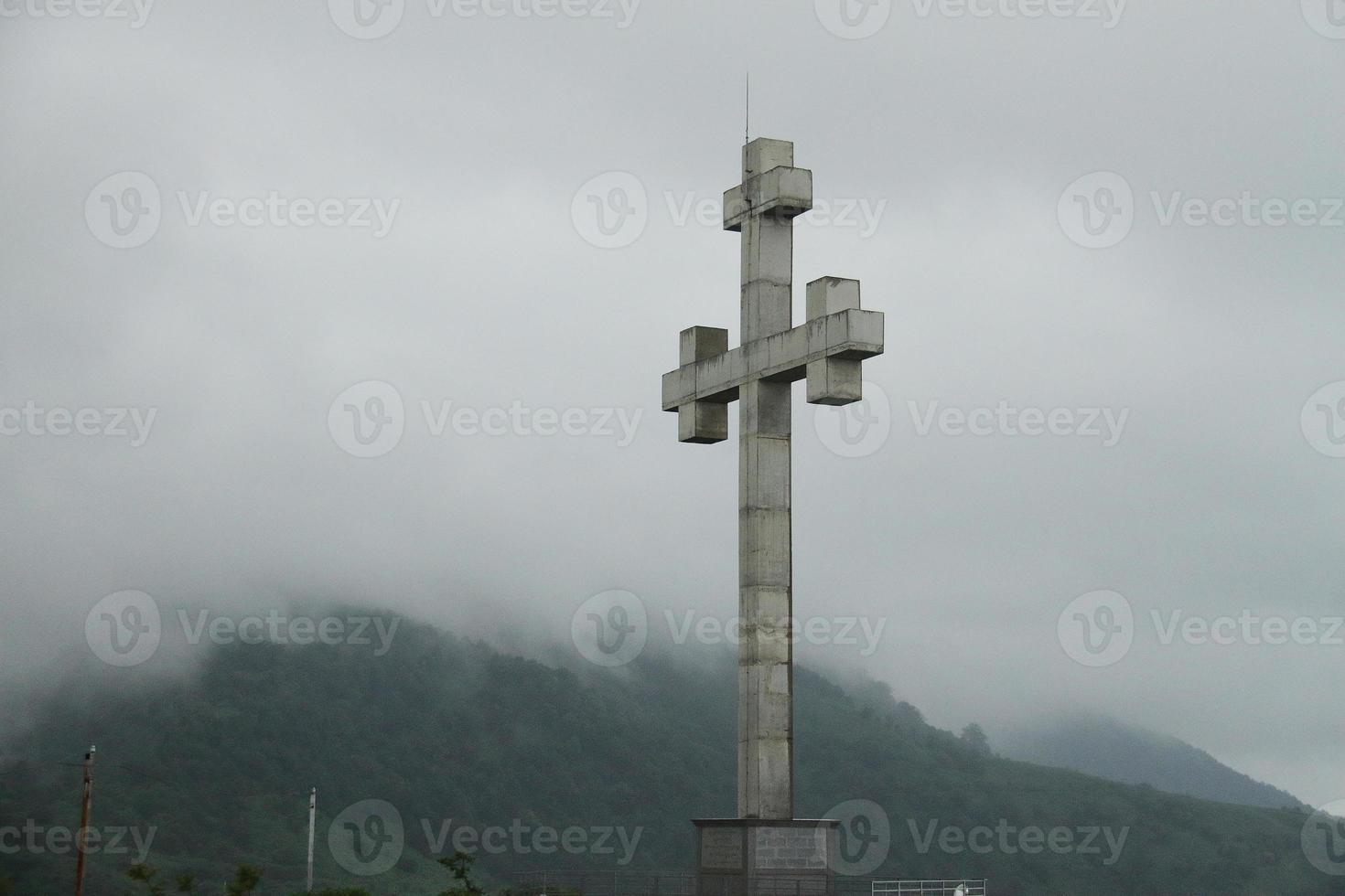 Stone medival cross on the mountain, Gergio Batumi photo