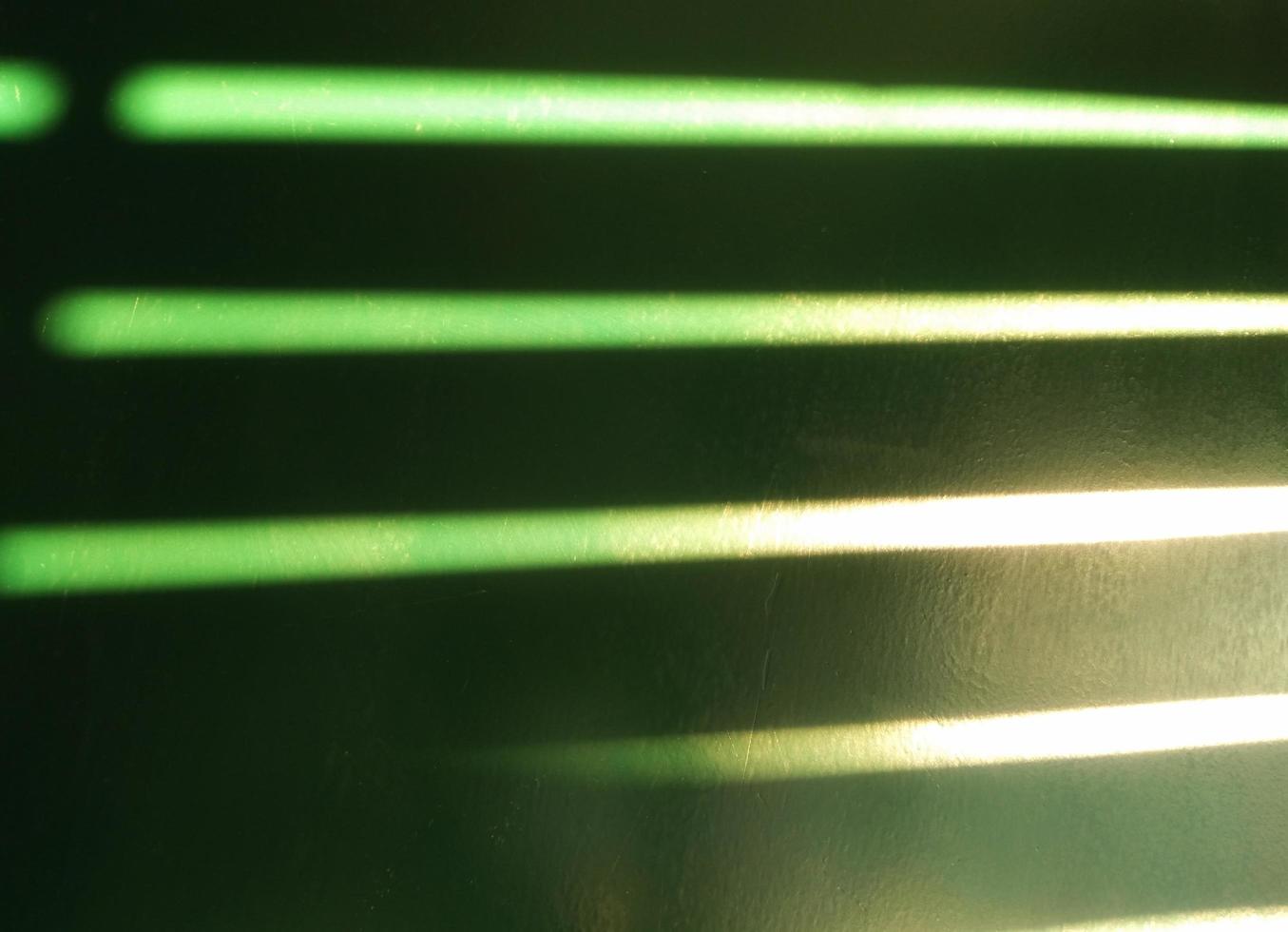 green steel door There was a long line of light shining from the sun through the slats. Use it as a background and wallpaper. photo