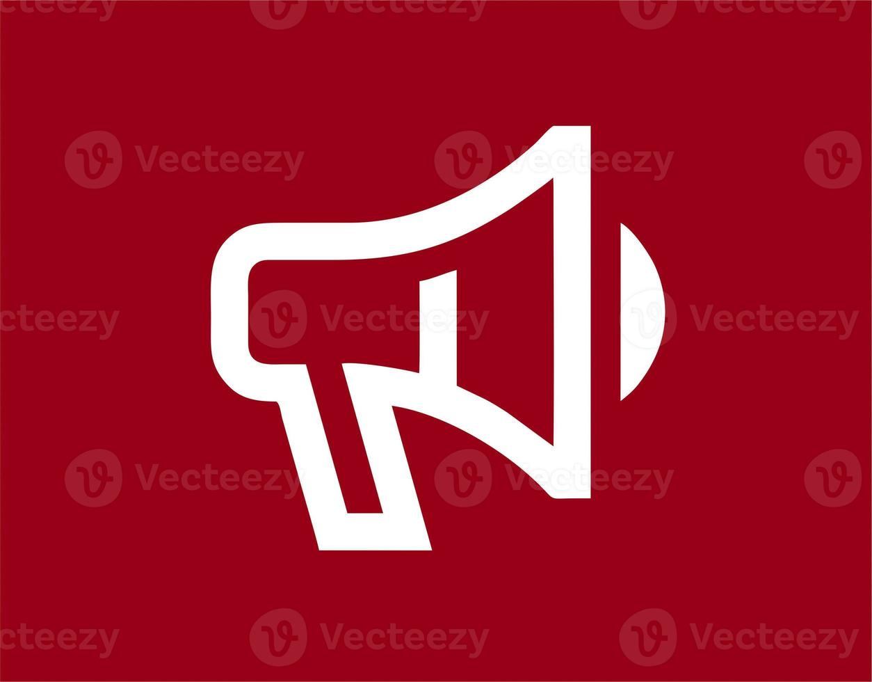 Illustration of a megaphone in white on a red background. simple megaphone design image. simple megaphone icon photo