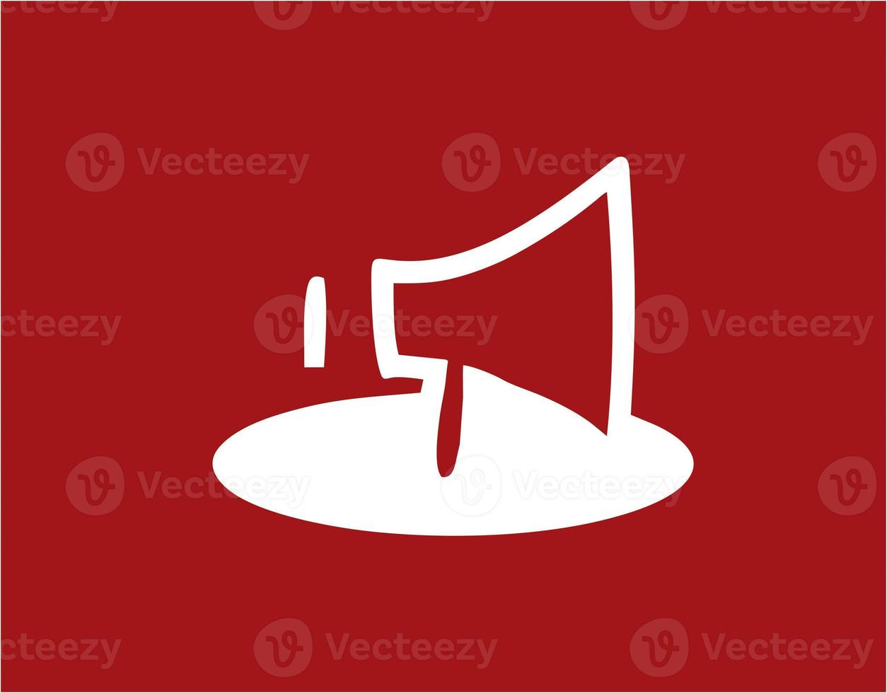 Illustration of a megaphone in white on a red background. simple megaphone design image. simple megaphone icon photo