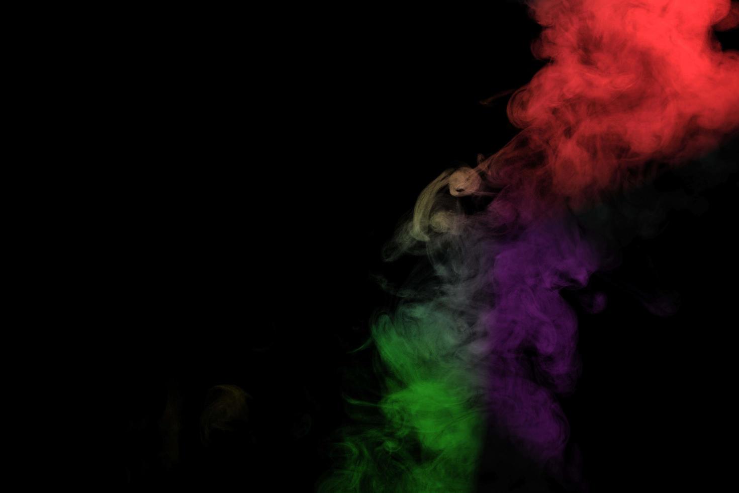 Abstract smoke isolated on black background,Rainbow powder photo