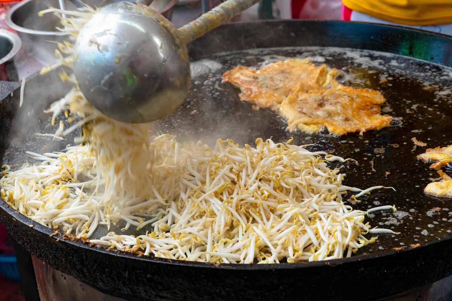 Fried bean sprouts in black pan photo