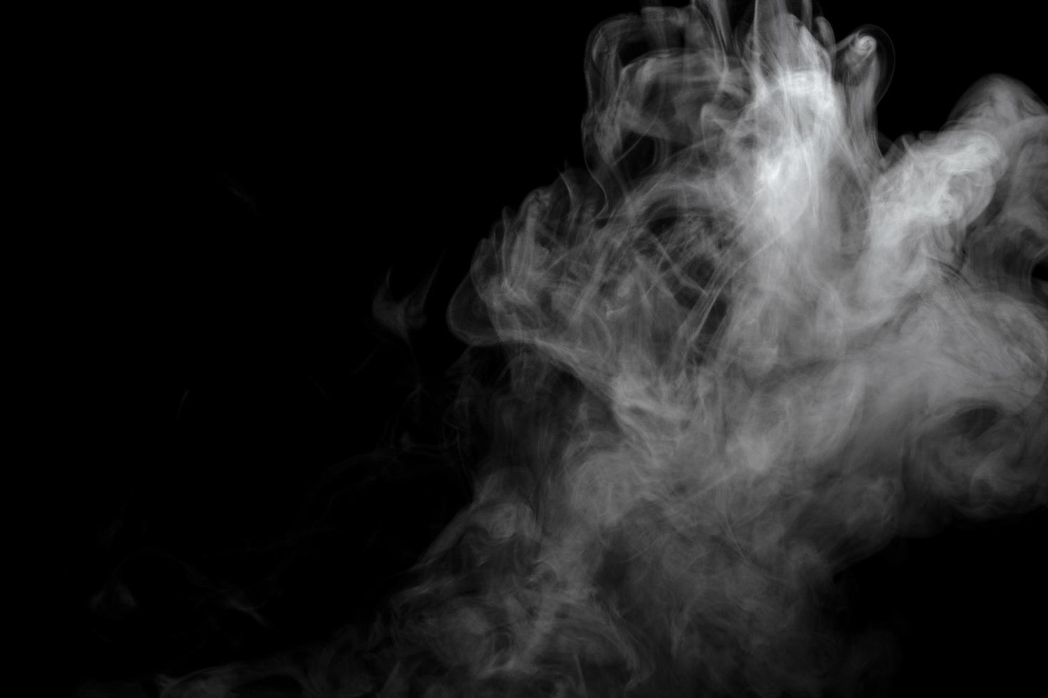 Abstract powder or smoke effect isolated on black background photo