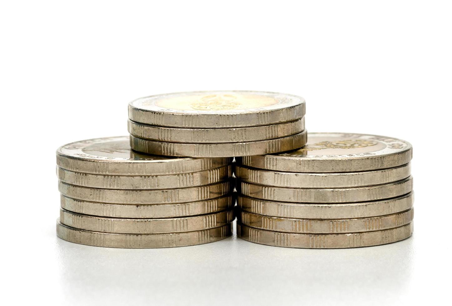 closeup silver coins stacks isolated on white background photo