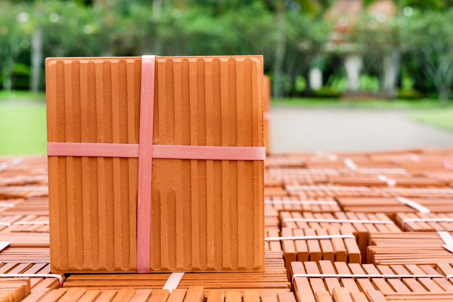 Stack of brown tiles at the constructing site photo