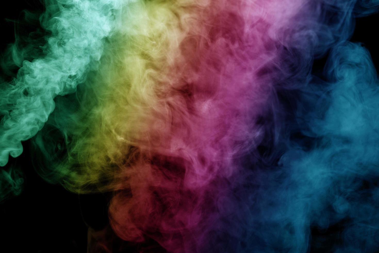 Abstract smoke isolated on black background,Rainbow powder photo