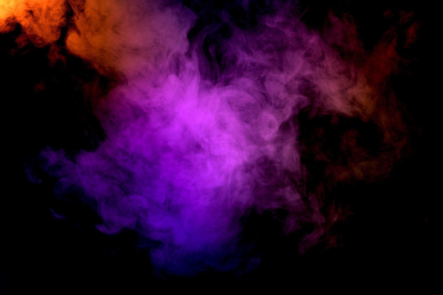 Abstract smoke isolated on black background,Rainbow powder photo