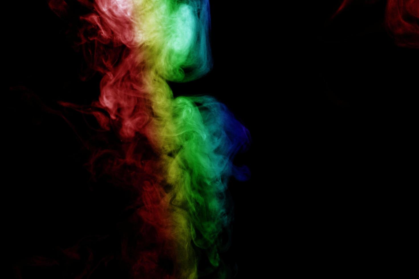 Abstract smoke isolated on black background,Rainbow powder photo