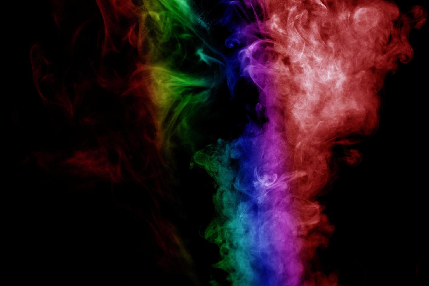 Abstract smoke isolated on black background,Rainbow powder photo