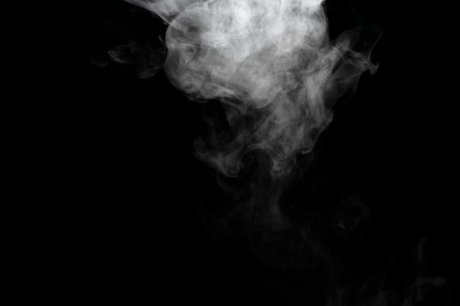 Abstract powder or smoke effect isolated on black background photo
