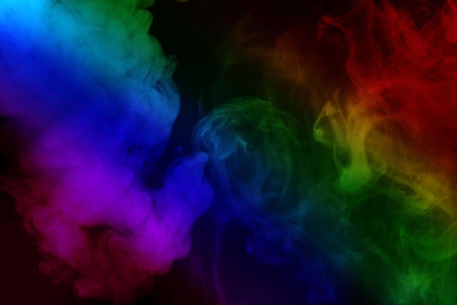 Abstract colorful smoke isolated on black background,Rainbow powder photo