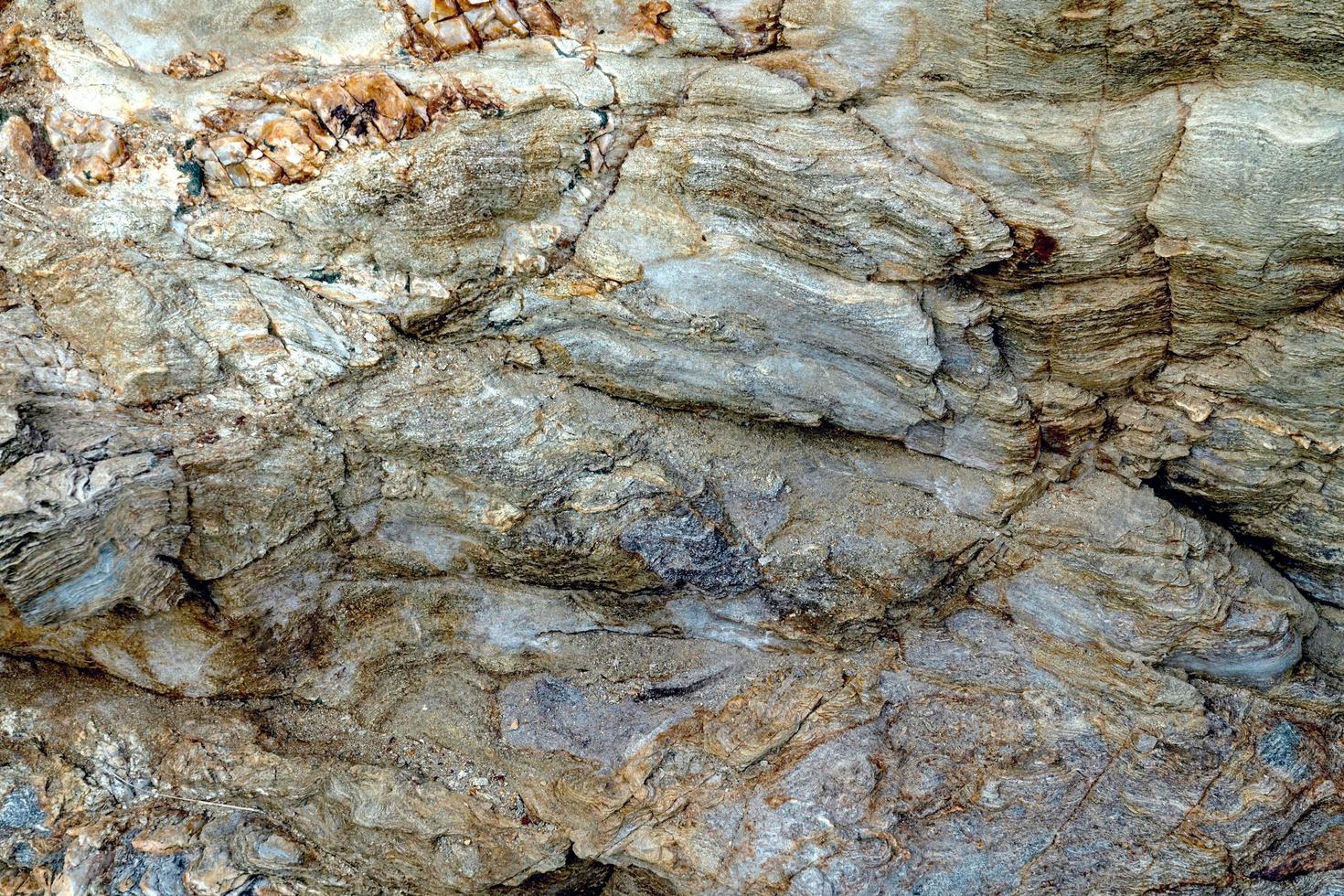 Primer plano de fondo de roca ígnea marrón foto