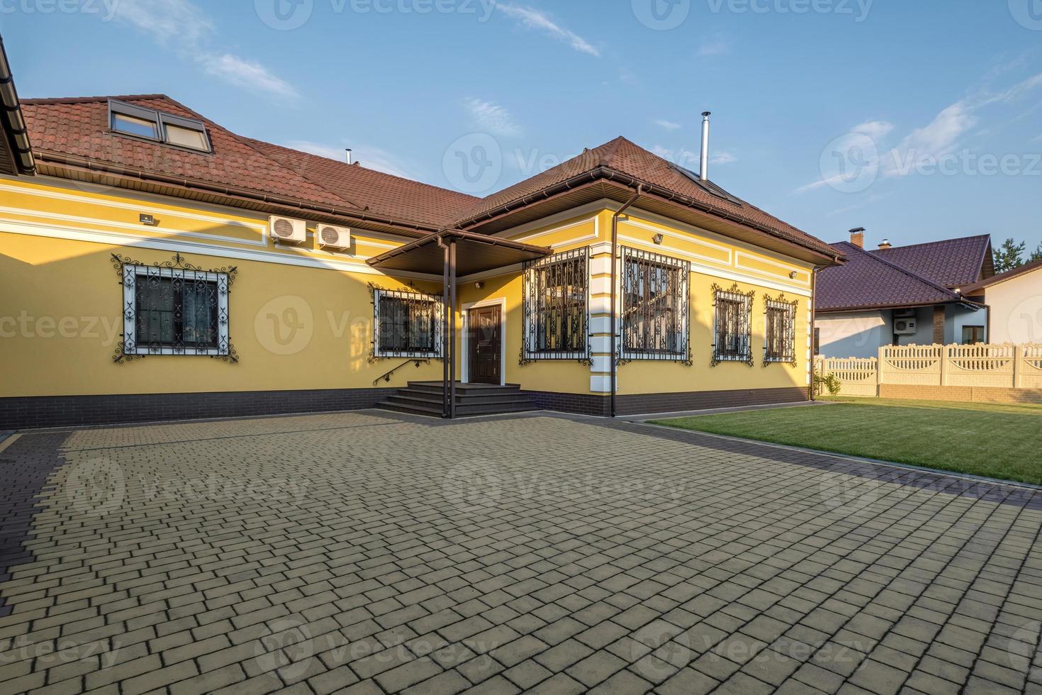 two-story concrete or brick country house photo