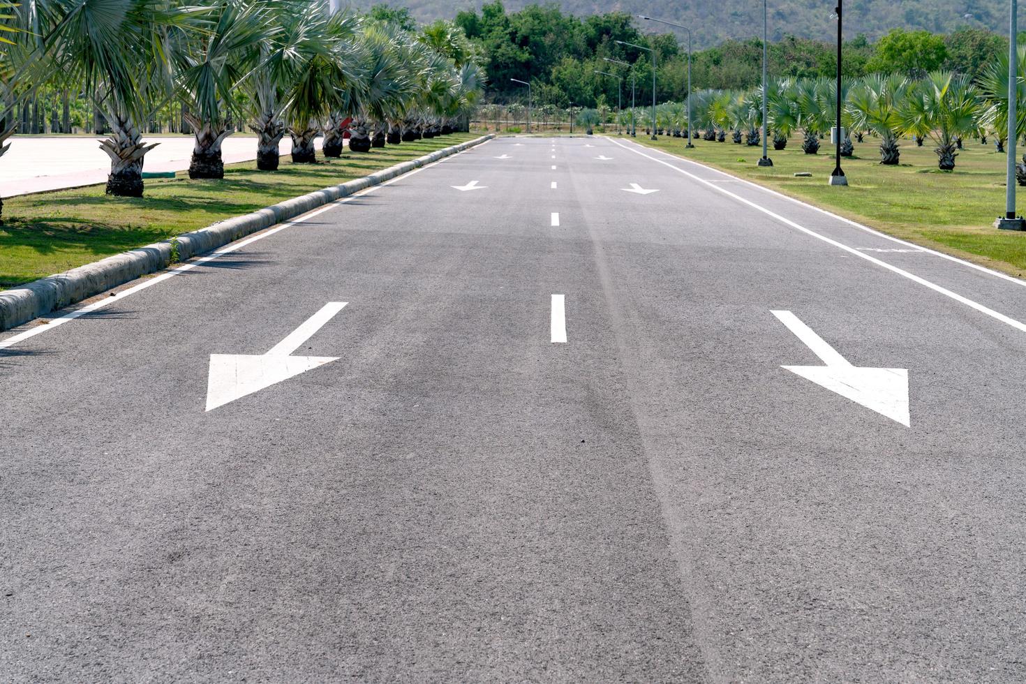 asphalt road with white arrow photo