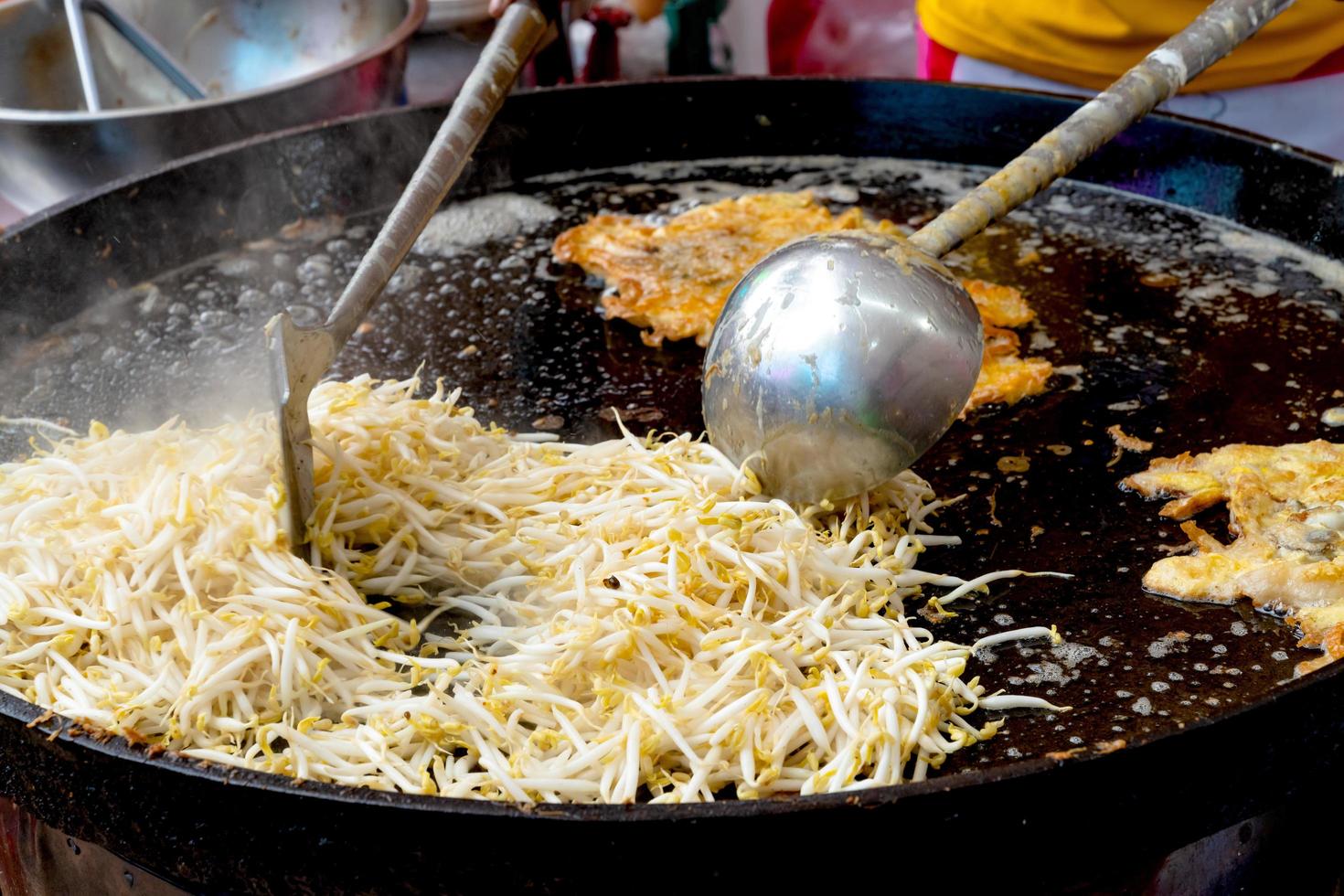 Fried bean sprouts in black pan photo