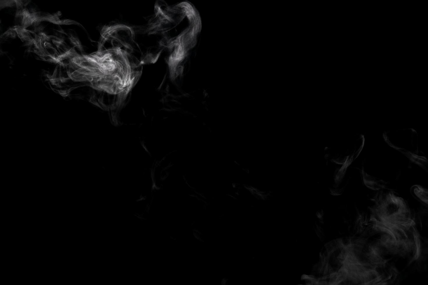 Abstract powder or smoke effect isolated on black background photo