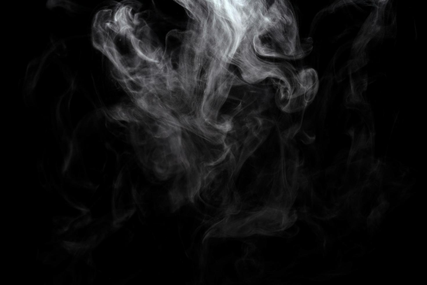 Abstract powder or smoke effect isolated on black background photo