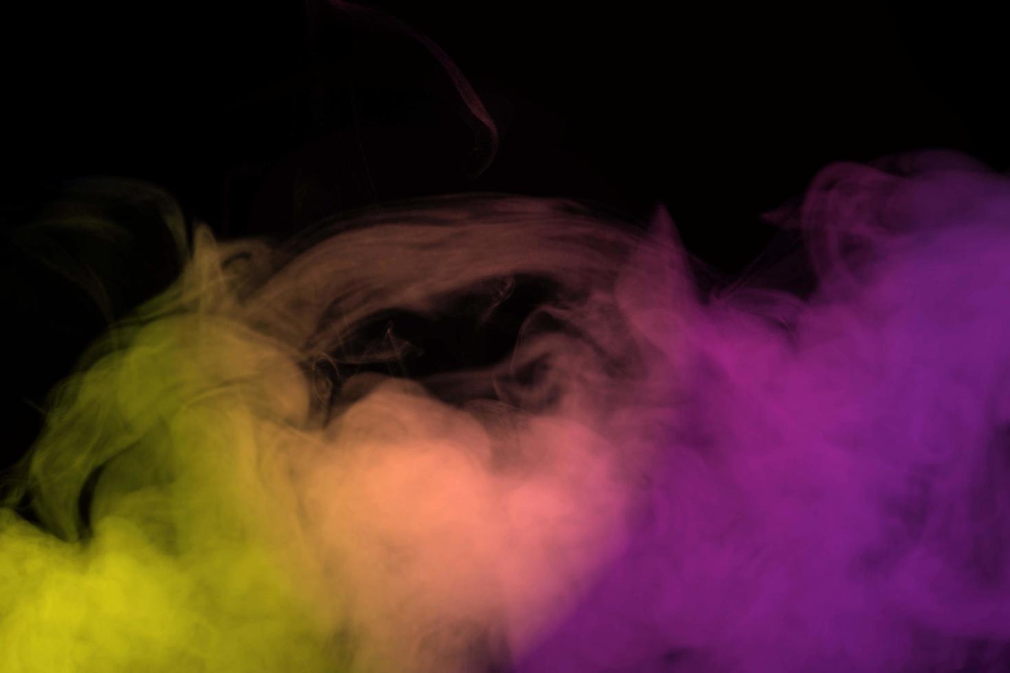 Abstract smoke isolated on black background,Rainbow powder photo