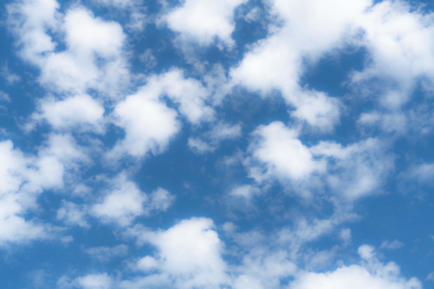 White cloud and blue sky background with copy space photo
