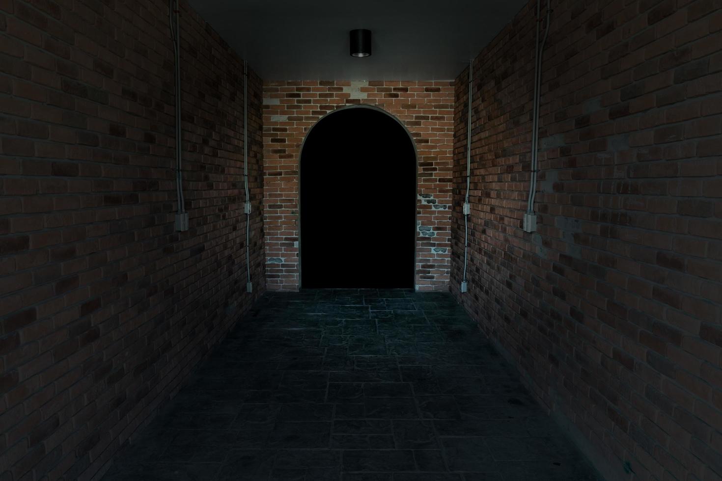 Red ancient archway brick isolated on black background photo