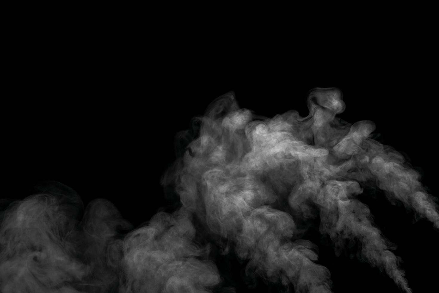 Abstract powder or smoke effect isolated on black background photo