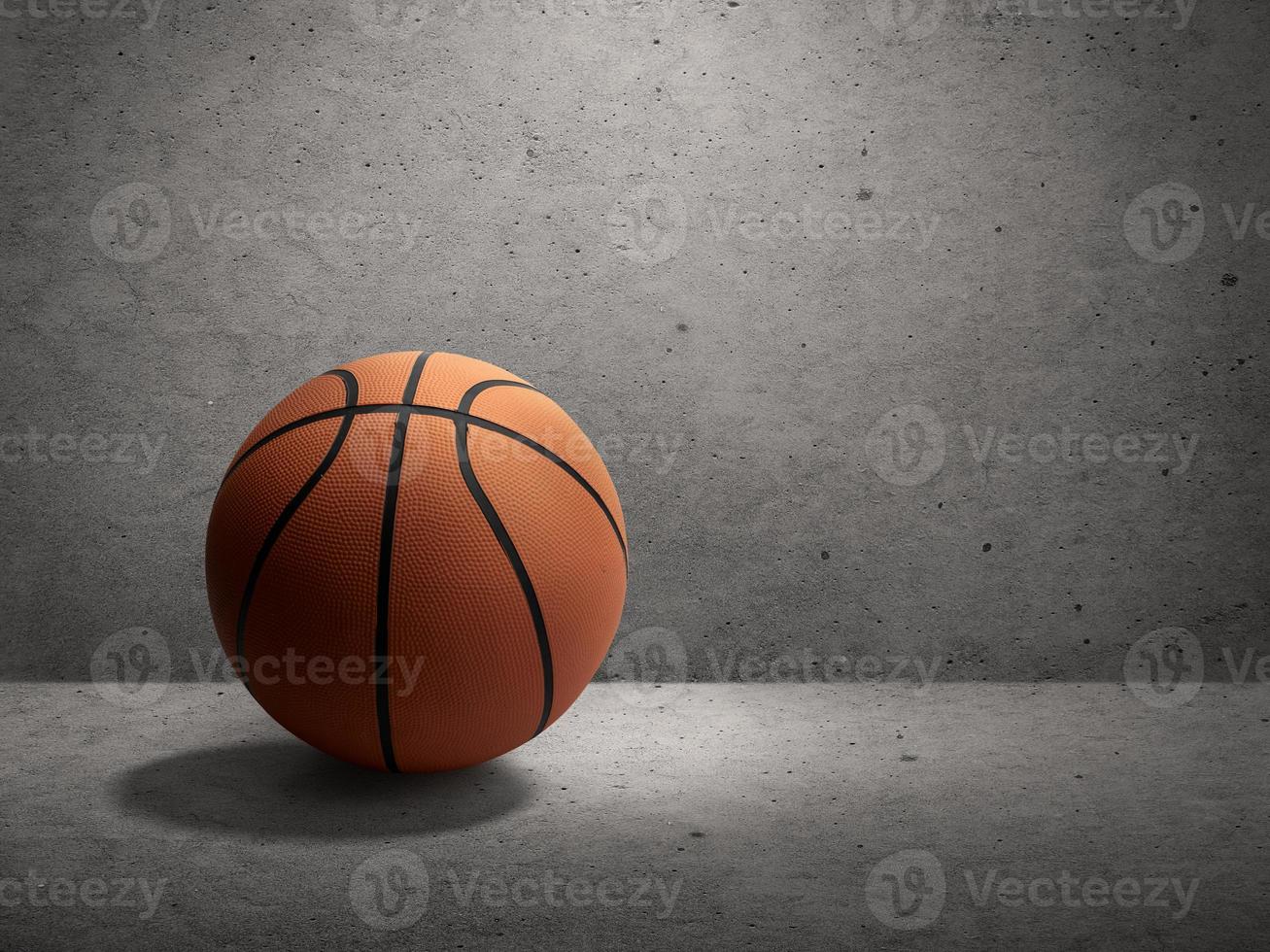 Basketball on cement wall background photo