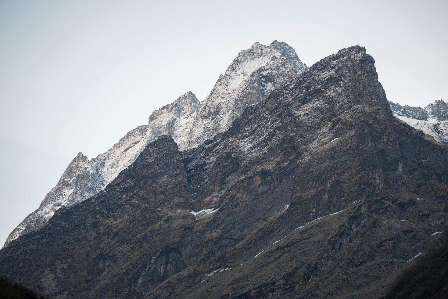 The mountains in the mist along the way to Annapurna base camp, Nepal. Annapurna Sanctuary Trek is most popular trek destination of Annapurna region. photo