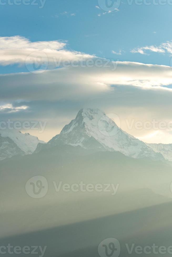 The beautiful clouds over Annapurna mountain range view from Poon Hill, Nepal during the morning sunrise. Poonhill Trek of Nepal is one of the most popular and easiest treks in Annapurna region. photo