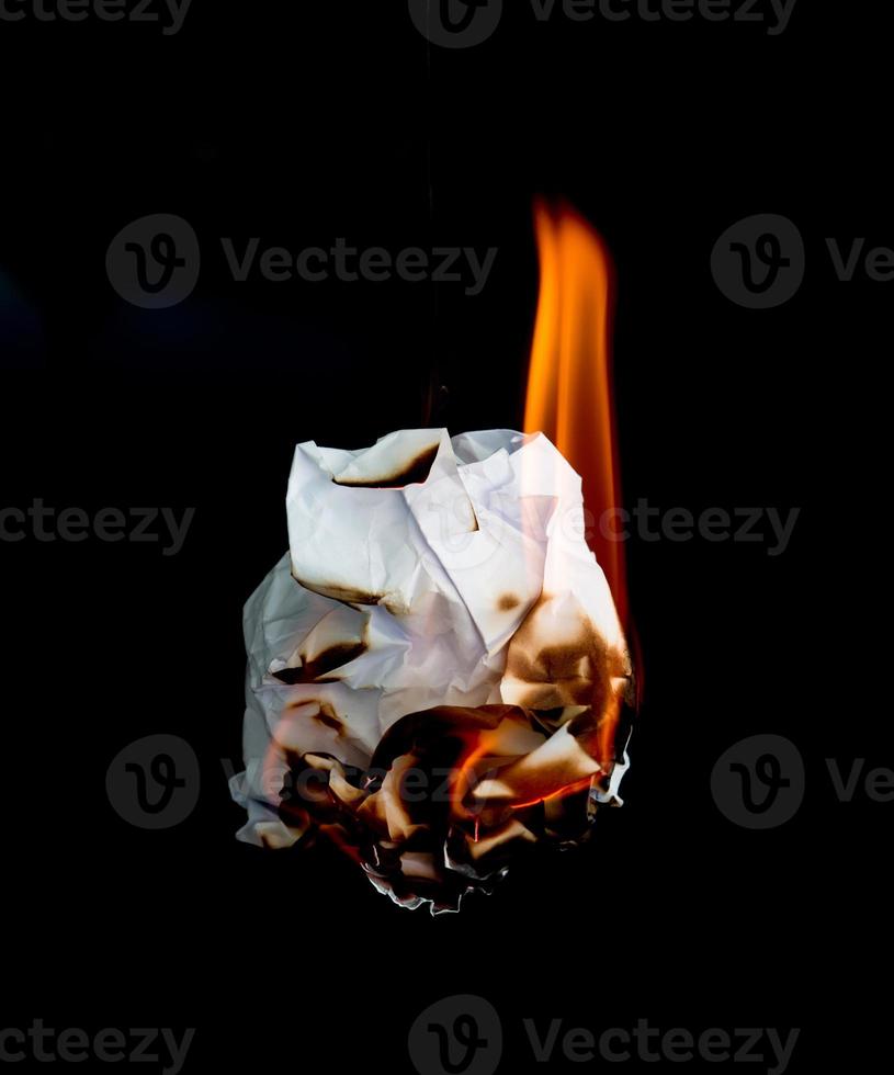 burning paper dark background photo