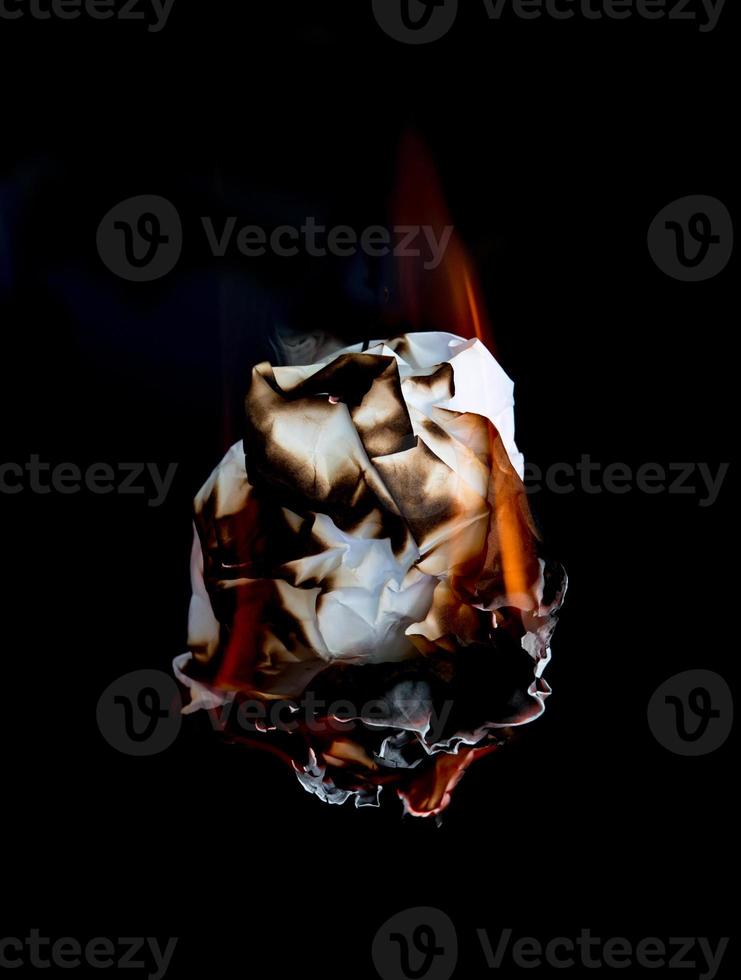 burning paper dark background photo