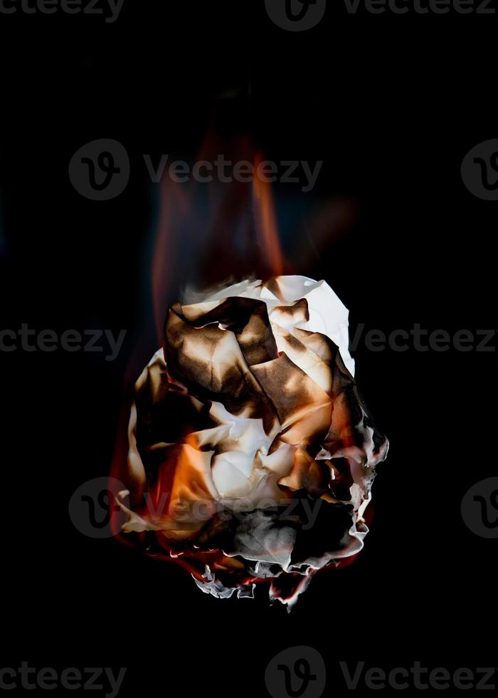 burning paper dark background photo