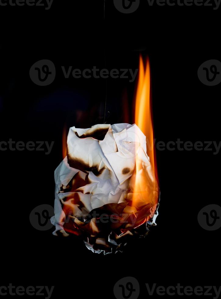 burning paper dark background photo