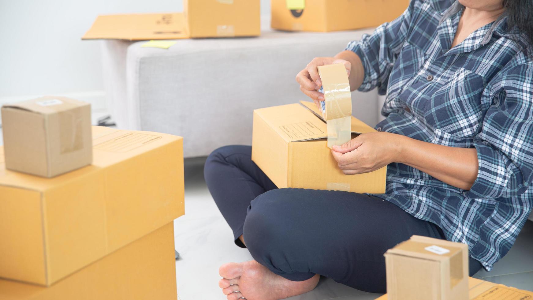 Women working freelance and packing box photo