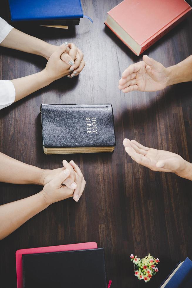 Group of people praying worship believe photo