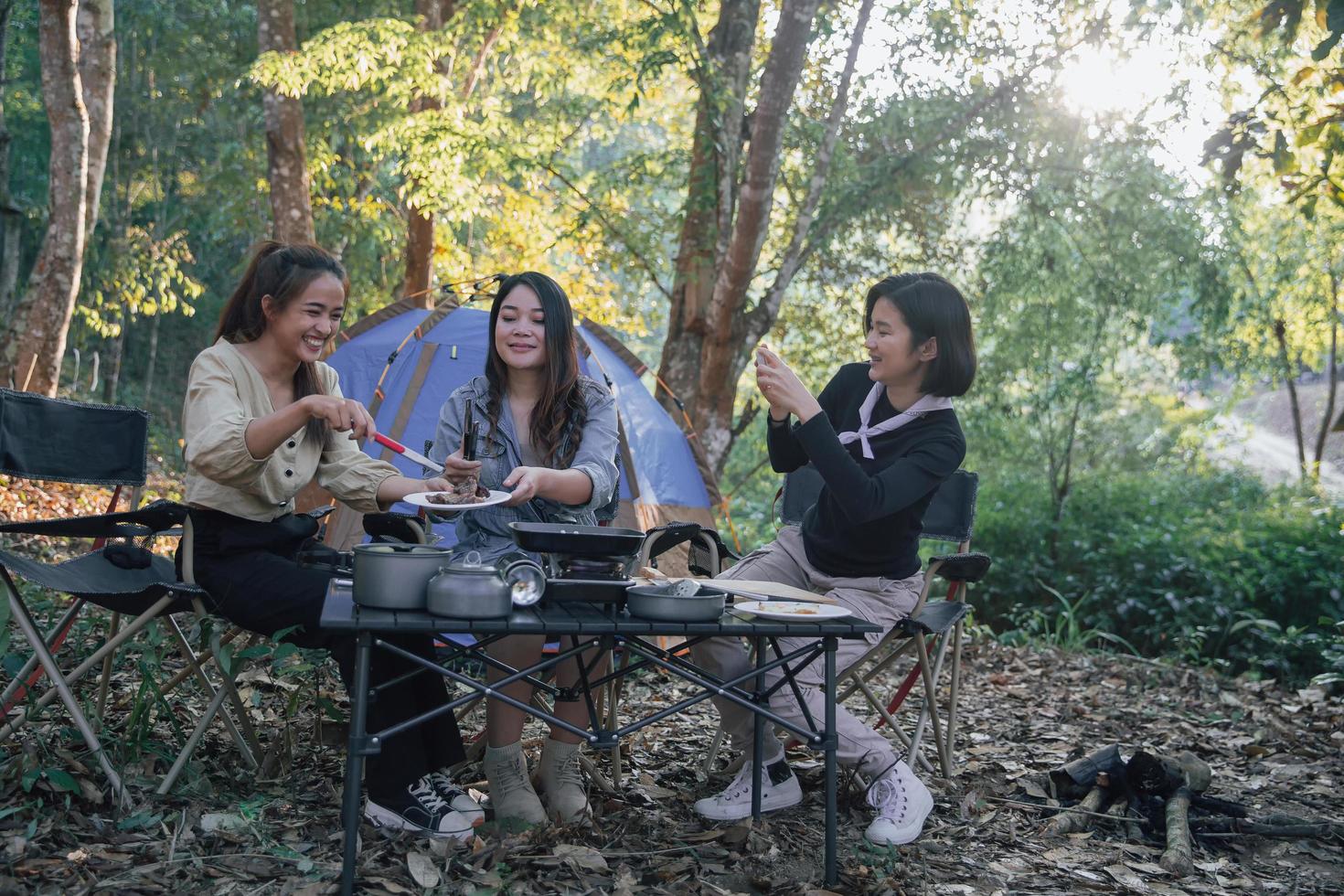three bestie go camping in the forest photo