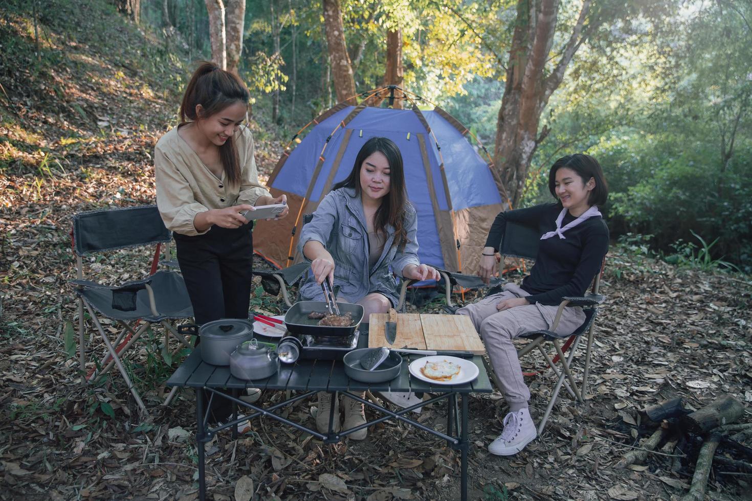 three bestie go camping in the forest photo